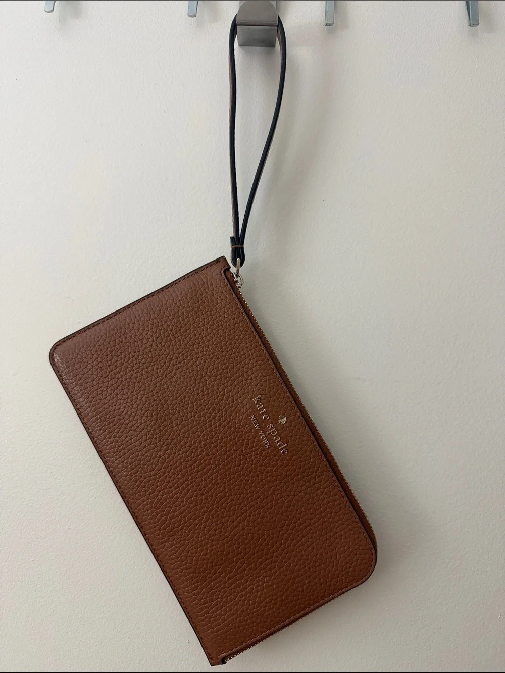 kate spade Pebbled Leather Wristlet with Strap in Warm Gingerbread